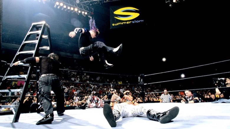 Jeff Hardy drops a leg onto Edge off a ladder at WWE SummerSlam 2000