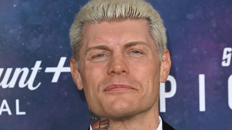 Cody Rhodes smiles at a press event 