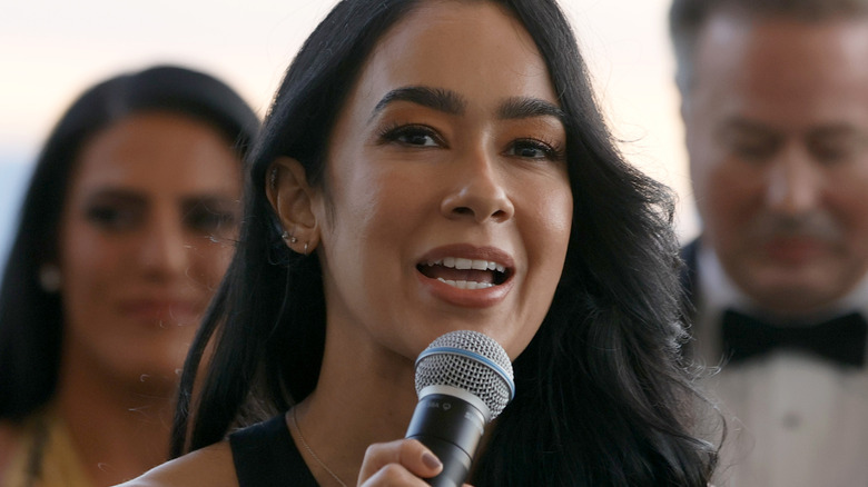 AJ Mendez speaking on a microphone