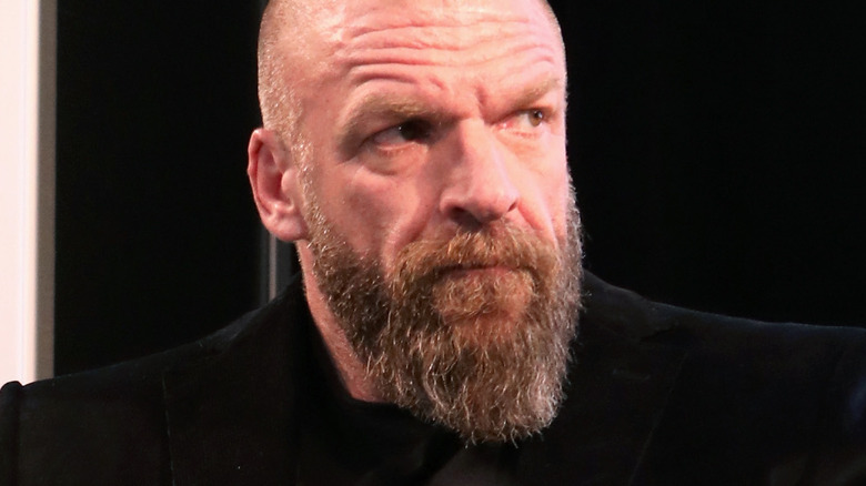 Triple H scowling