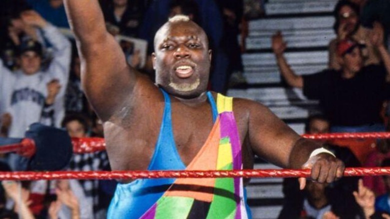 Sir Mo poses in the corner, waiting for a tag during a match on WWE programming.