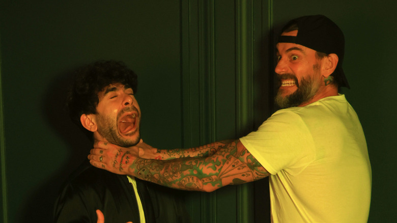 CM Punk jokingly choking Tony Khan
