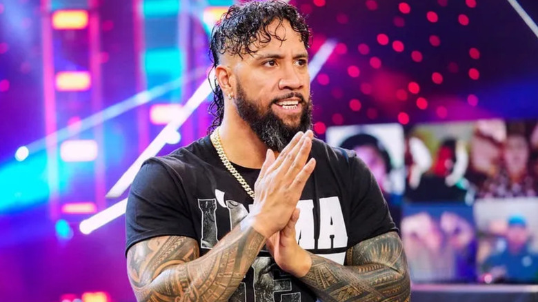 Jey Uso rubbing his hands together