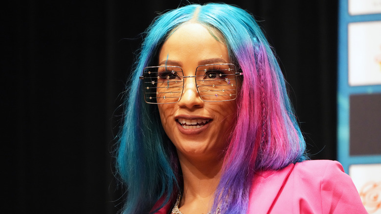 Mercedes Mone wearing a pink outfit at an event