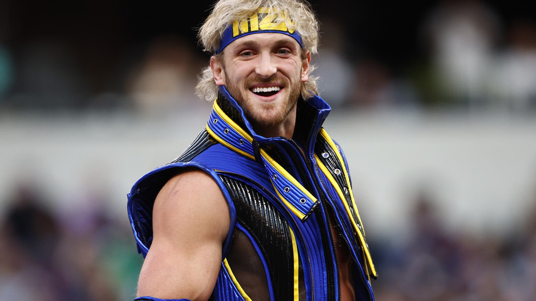 Logan Paul wearing blue and yellow ring gear