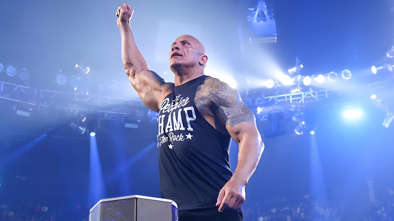 The Rock raising an arm