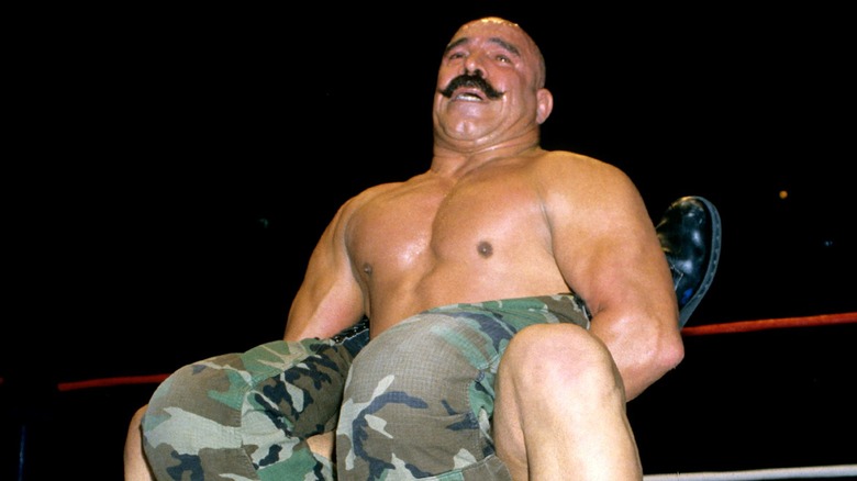 The Iron Sheik puts Corporal Kirchner in a Boston Crab