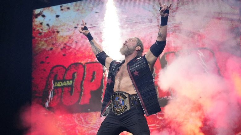 One half of the AEW World Tag Team Champions, Adam Copeland, hits his signature pose on the stage before a match on the July 15 edition of "AEW Dynamite."