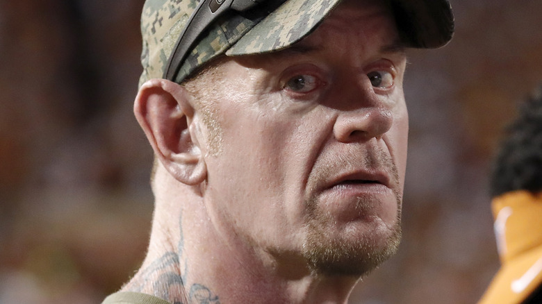 The Undertaker wearing camo hat