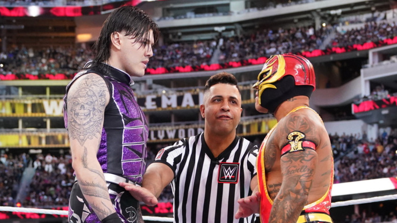 Rey and Dominik Mysterio staring off