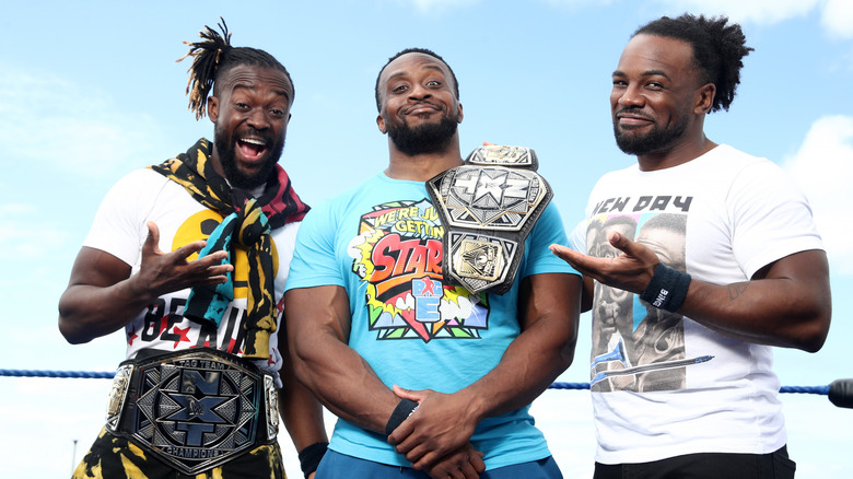 Kofi Kingston, Big E, and Xavier Woods standing together