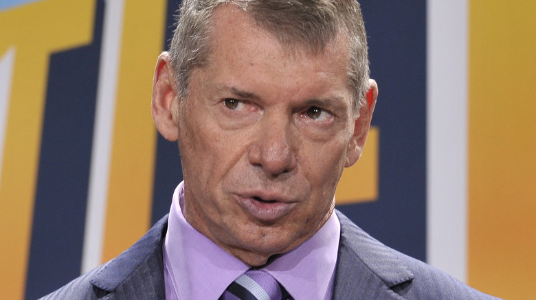Vince McMahon speaking at a press conference
