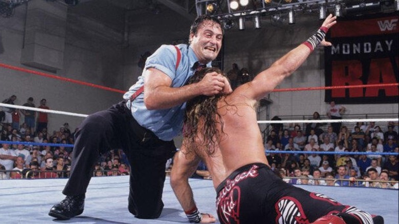 I.R.S. era Mike Rotunda with a headlock on Shawn Michaels