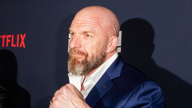 Triple H holds up a fist