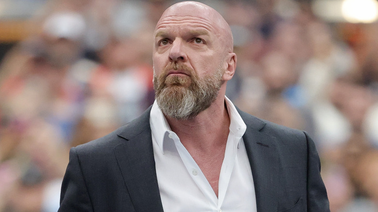 Triple H wearing a suit