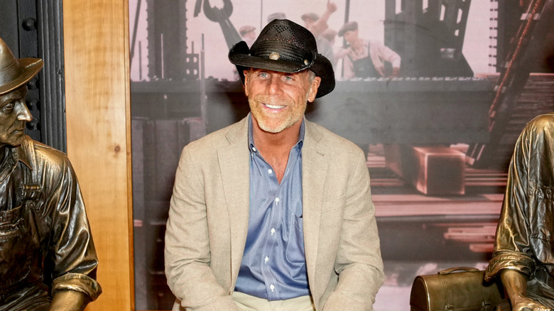 Shawn Michaels is seated