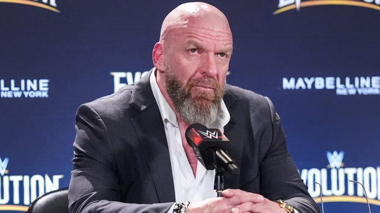 Triple H wearing a suit