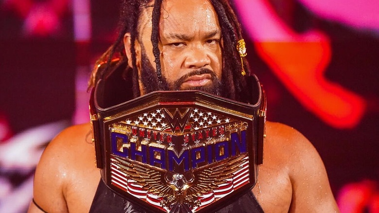 Jacob Fatu wearing US title belt around his neck at WWE Backlash