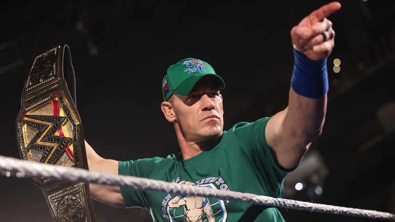 John Cena holds the WWE Title