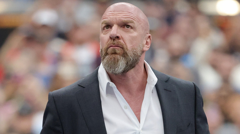 Triple H wearing a suit