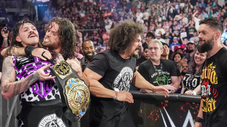 The Judgment Day celebrating Dominik Mysterio's successful IC title defense at WWE Backlash