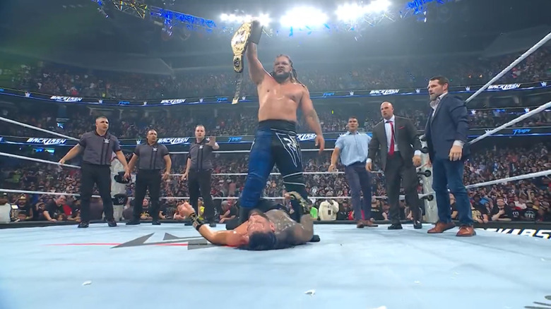 Jacob Fatu stands tall over Roman Reigns