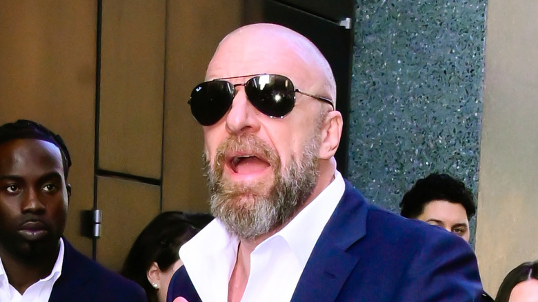 Triple H staring straight into the flash of a camera