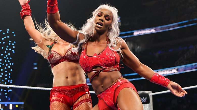 Jade Cargill hits an uppercut on Tiffany Stratton during a triple threat match where Cargill was injured by Nia Jax during a botched move on 