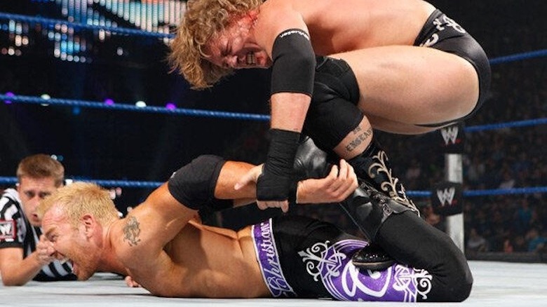 William Regal stretching Christian in a submission hold at WWE Breaking Point