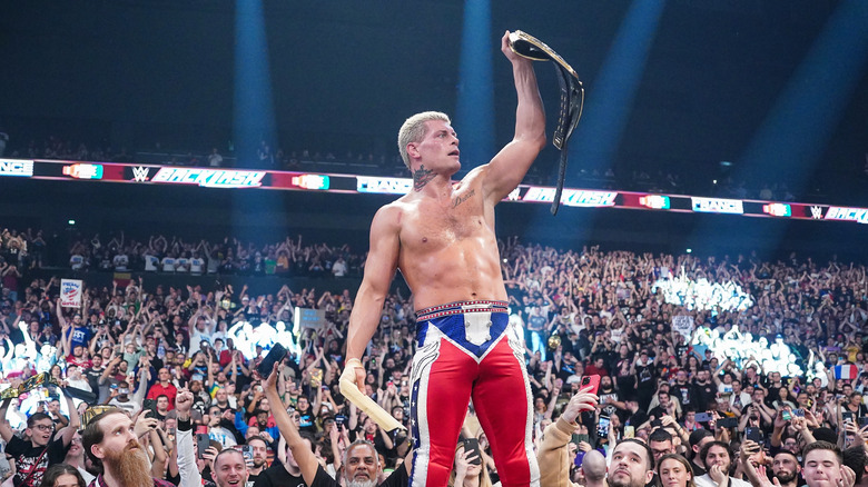 Cody Rhodes poses with the championship