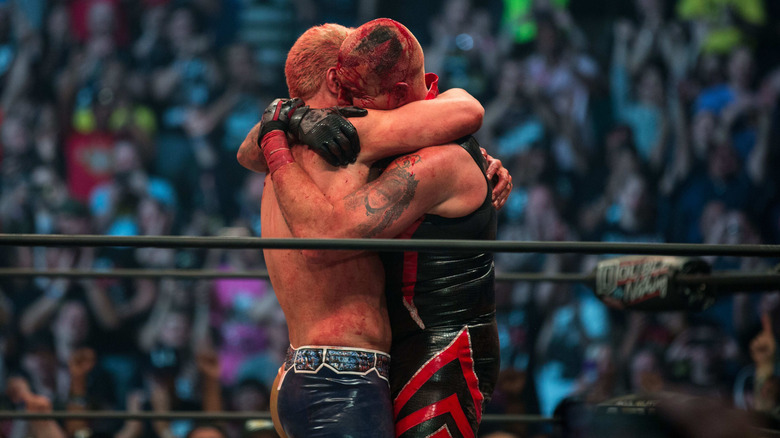 Cody and Dustin Rhodes embrace after their match at AEW's Double or Nothing pay-per-view