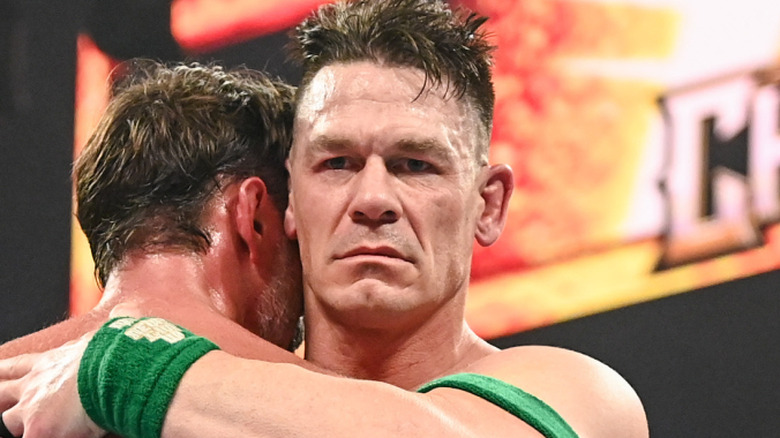 John Cena, unhappy to be hugging CM Punk