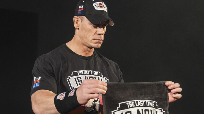John Cena solemly holds a 