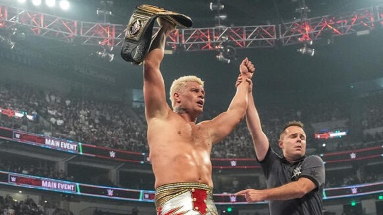 Cody Rhodes celebrates with his WWE Championship