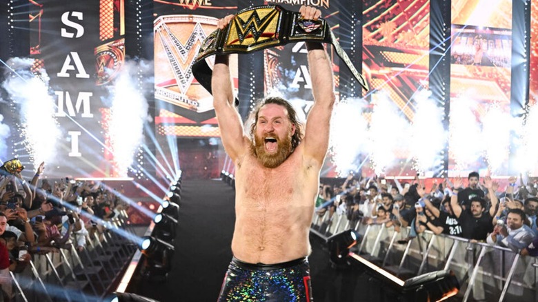 Sami Zayn hoists the Undisputed WWE Title at Night of Champions