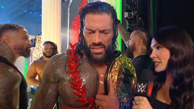 Roman Reigns talks after Clash in Italy, flanked by the Usos and Jacob Fatu