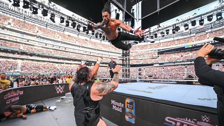 Roman Reigns leaps onto Bronson Reed