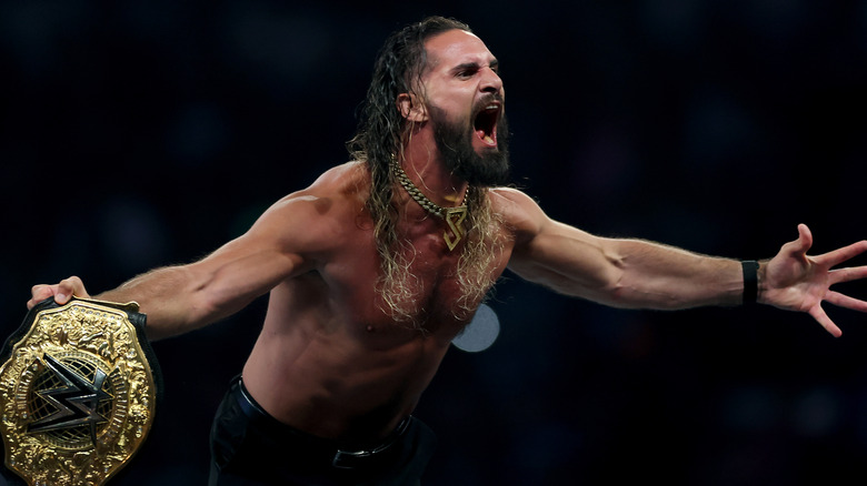 Seth Rollins celebrates after winning the WWE World Heavyweight Championship after cashing in his Money in the Bank contract to take on CM Punk during the WWE 2025 SummerSlam at MetLife Stadium on August 02, 2025 in East Rutherford, New Jersey.