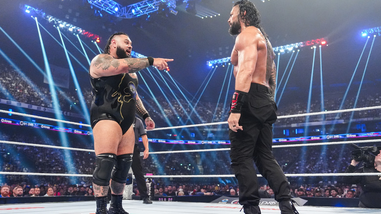 Reed and Reigns staring one another down in the ring