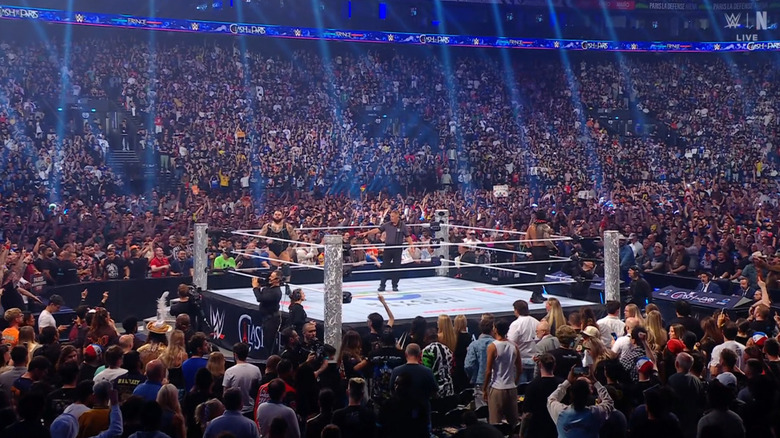 Reed and Reigns before locking up in the ring