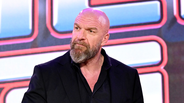 Triple H receiving a question that isn't asking about his greatness