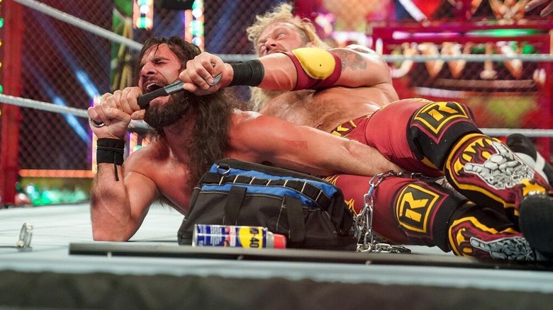 Edge gets Seth Rollins in a weapon-assisted submission at WWE Crown Jewel 2021