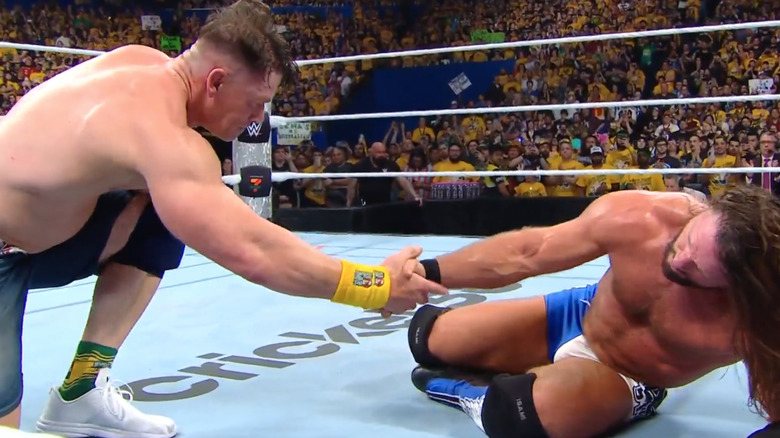 AJ Styles and John Cena shake one another's hands after Crown Jewel match