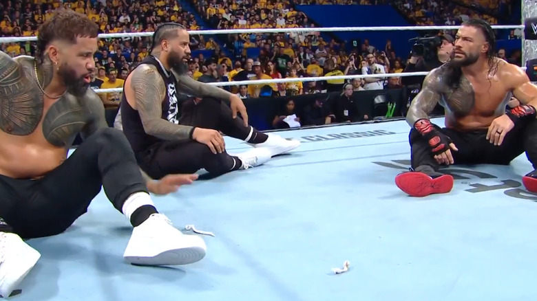 The Usos and Roman Reigns argue in the ring