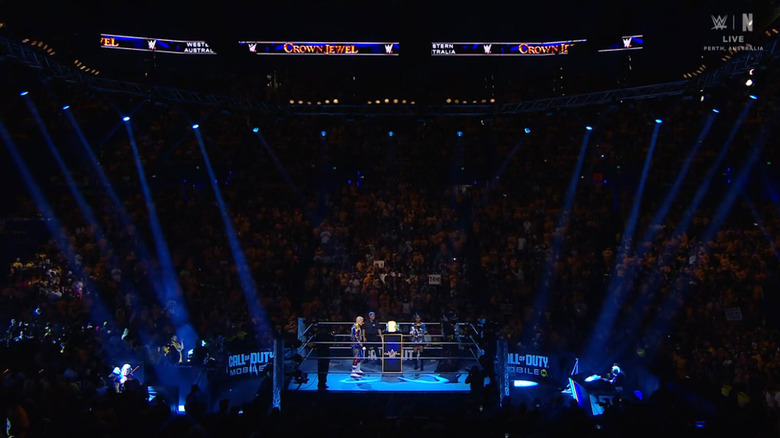 Rhodes and Rollins staring each other down in the ring
