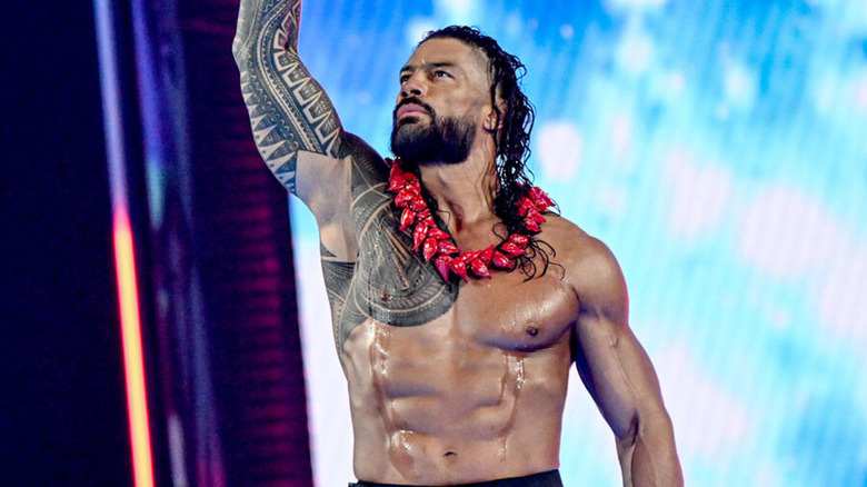 Roman Reigns sports the ula fala as he makes a solo entrance as 