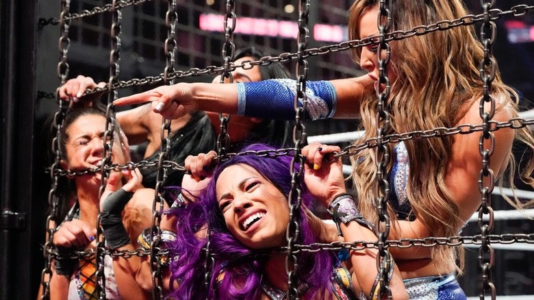 The IIconics mash Sasha Banks' and Bayley's faces against the chains at WWE Elimination Chamber 2019