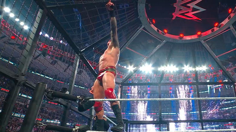 Randy Orton points while fireworks go off at WWE Elimination Chamber