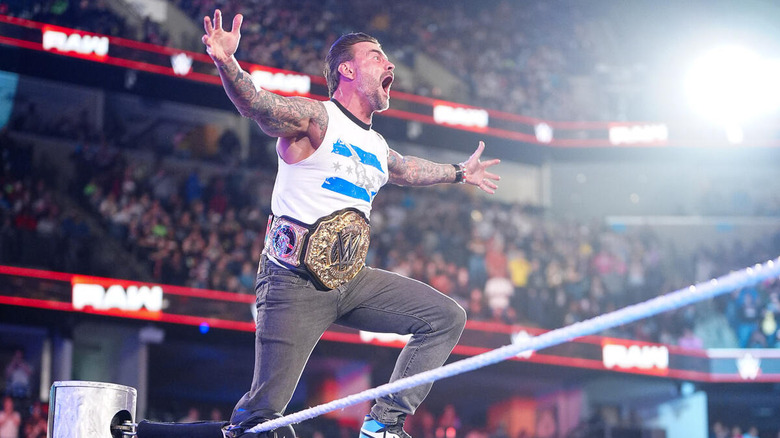 CM Punk posing on the ropes on "WWE Raw"