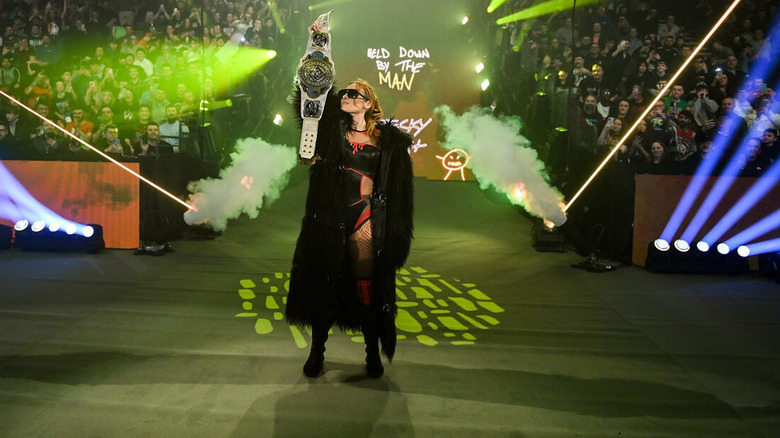 Becky Lynch holds up the Women's Intercontinental Championship on "WWE Raw"
